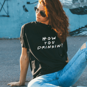 female wearing a black friends themed graphic tee