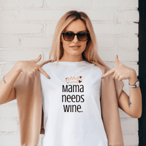 Blonde female wearing a graphic tee for mama needs wine
