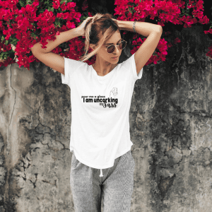 Female wearing a white graphic statement tee