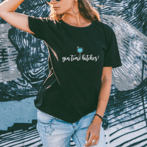 woman wearing a black gin time bitches graphic tee