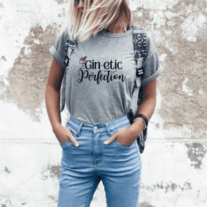 Woman wearing a greay gin-ectic perfection graphic tee