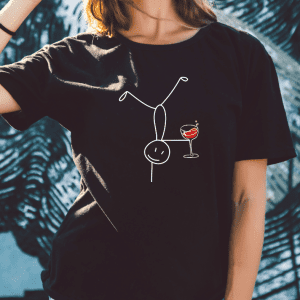 female wearing a black tee with a stickman doing cartwheel holding a glass of wine