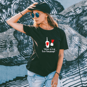 Female wearing a wine is my lobe language graphic tee
