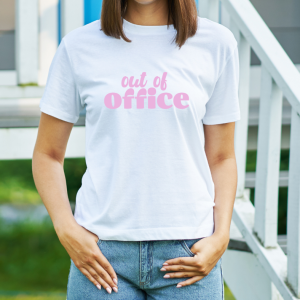 female wearing a white shirt with pink out of office text