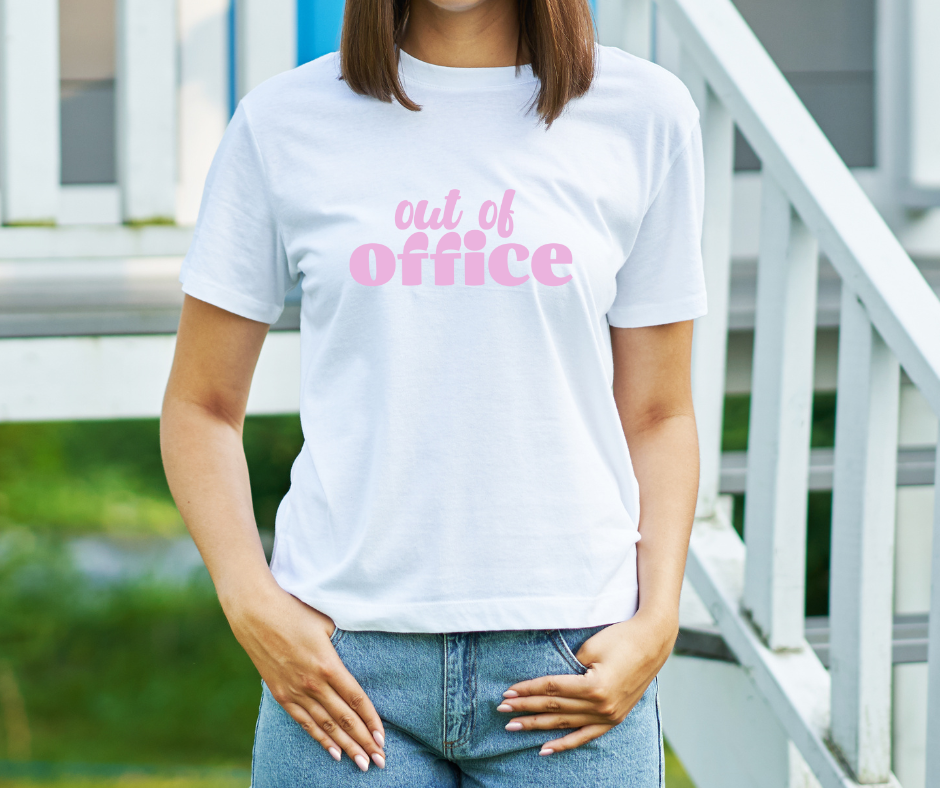 female wearing a white shirt with pink out of office text